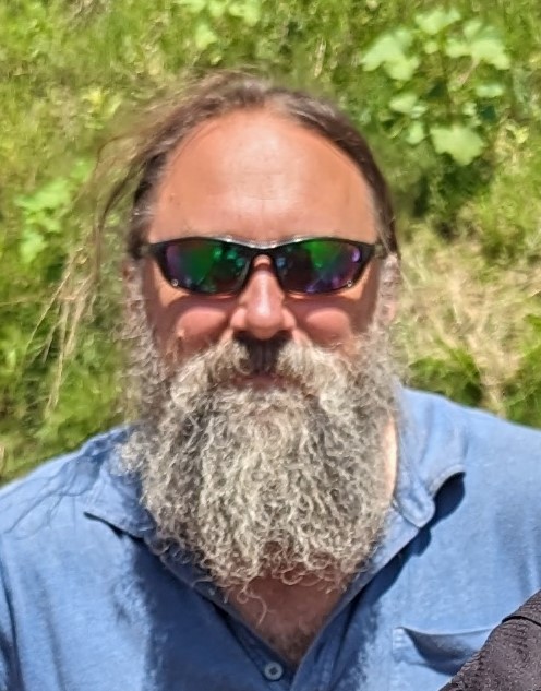 Professional headshot of Christopher Dutton, Assistant Professor