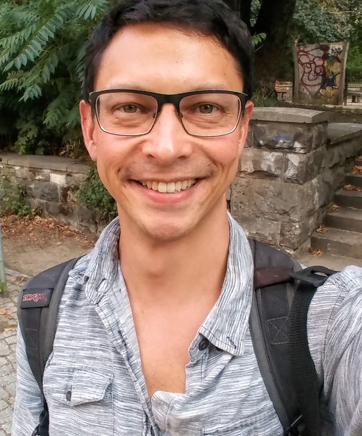 Professional headshot of David Kikuchi